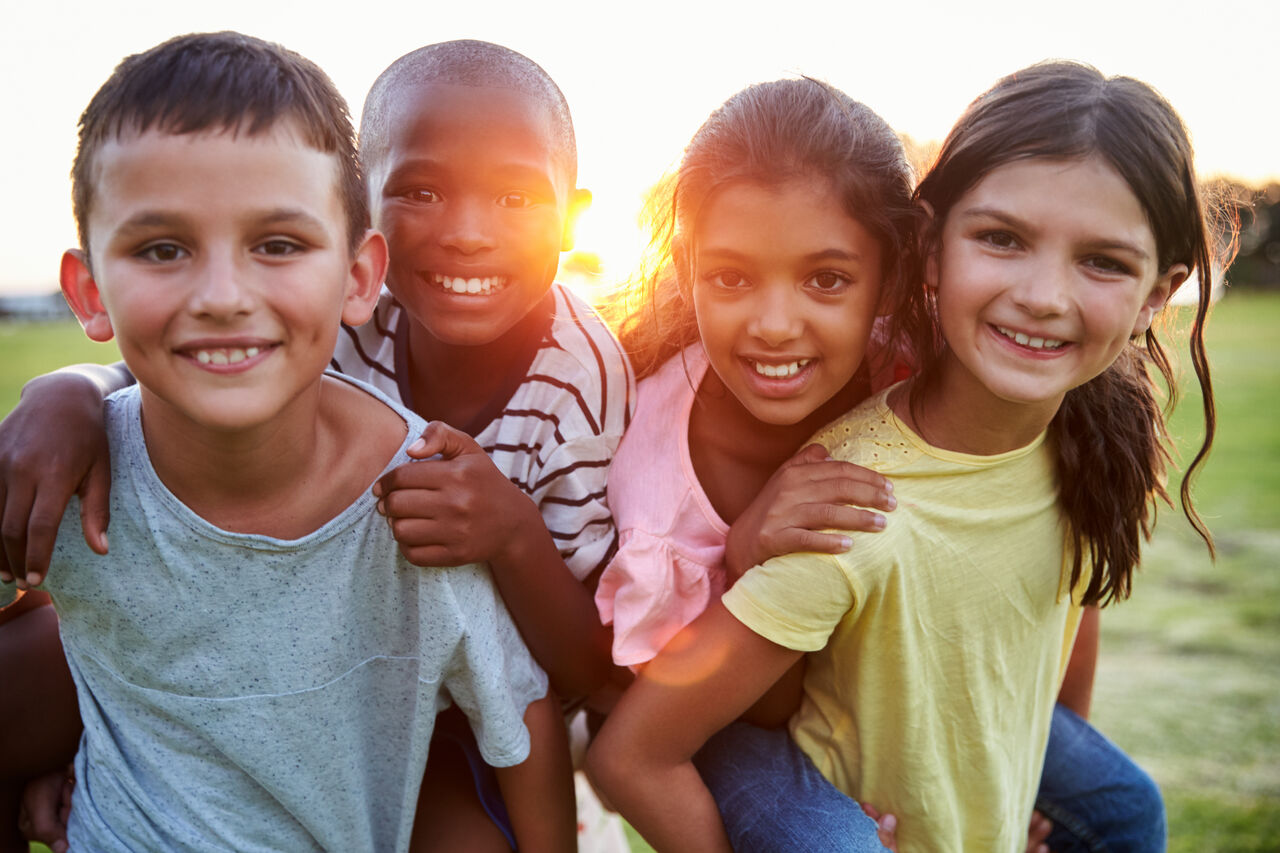 Kids playing at sunset