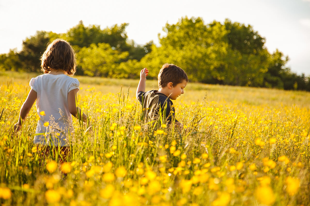 Children running in a field