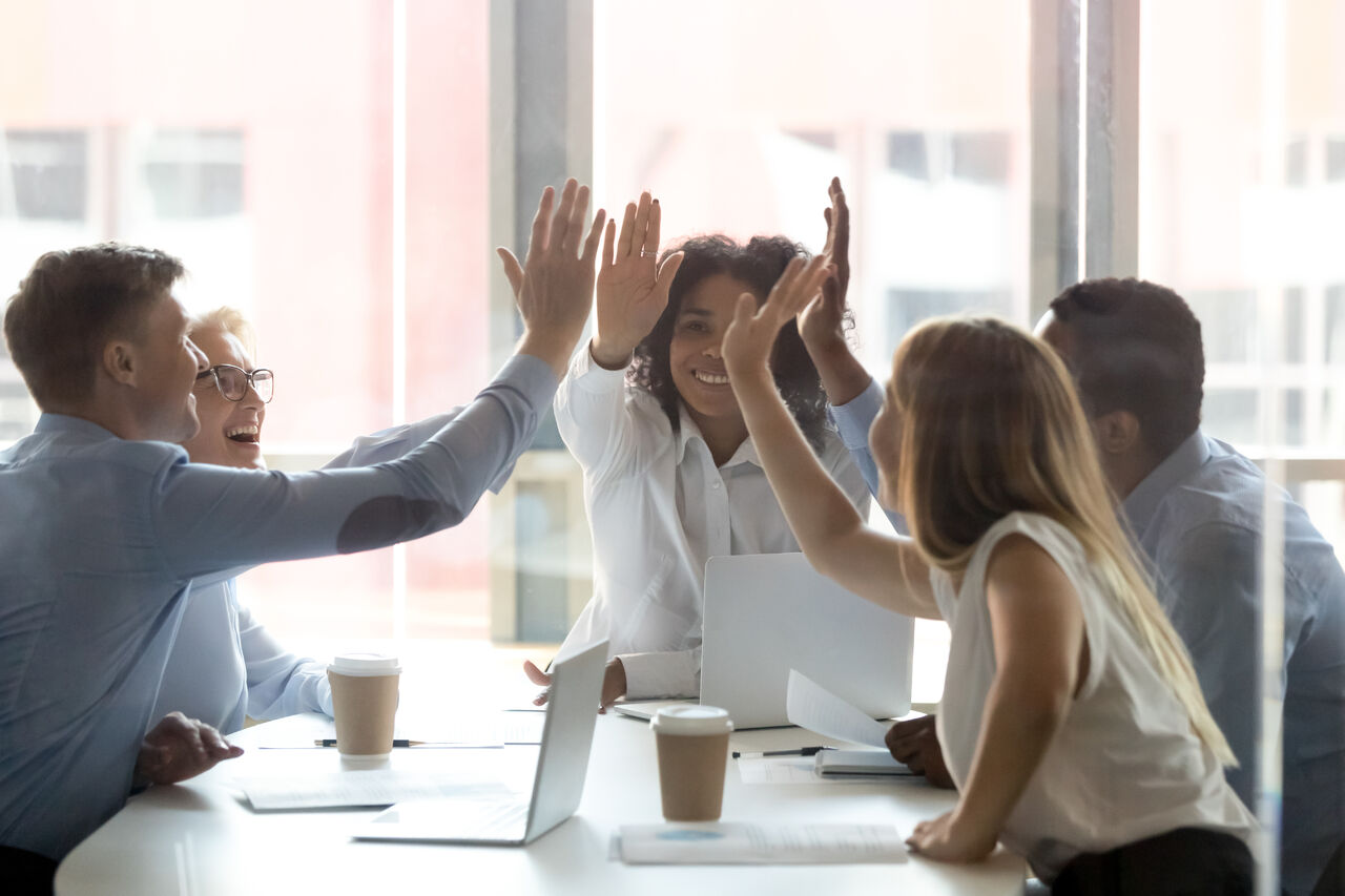 A team giving each other high-fives.